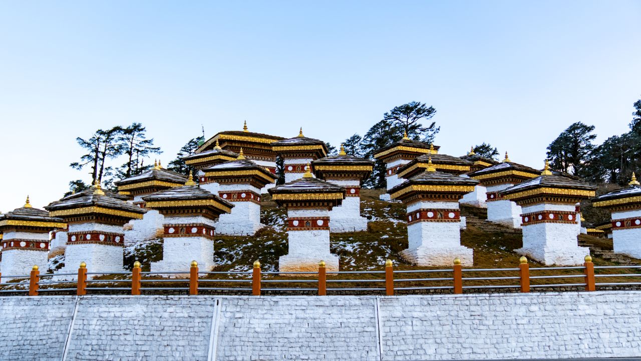 Scenic landscape of Dochula Pass showing its famous chortens and breathtaking backdrop.
