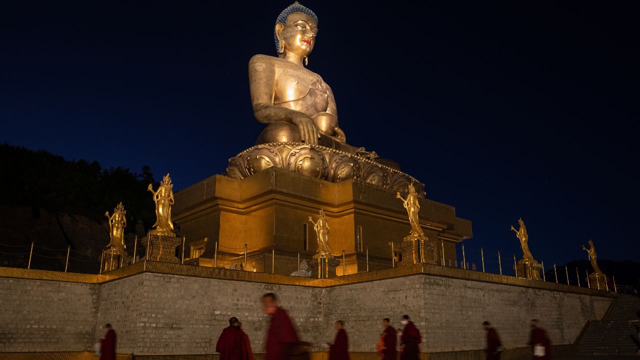 Buddha Dordenma Statue in Thimphu, Bhutan, overlooking the valley with golden details and serene surroundings.