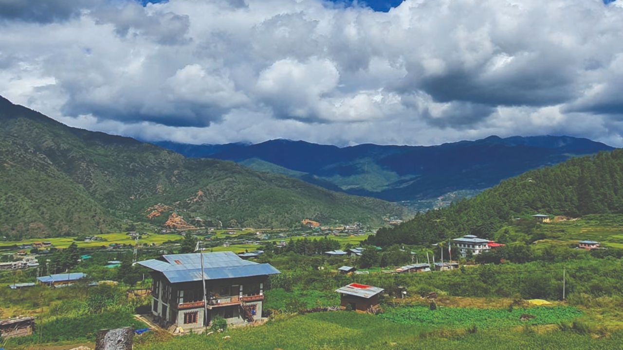 A stunning landscape of Bhutan’s Haa Valley with open fields and mountain views.