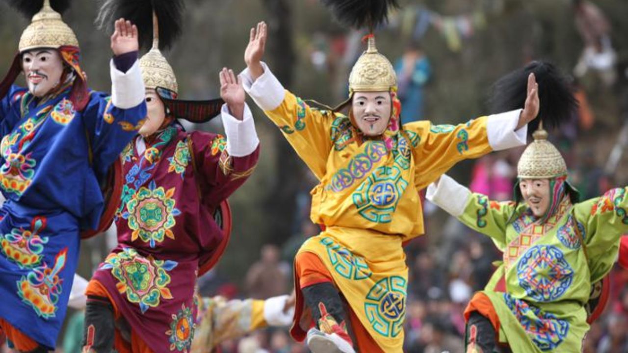 Traditional masked performers at the Druk Wangyel Tsechu, celebrating the service of the Royal Bhutan Army.