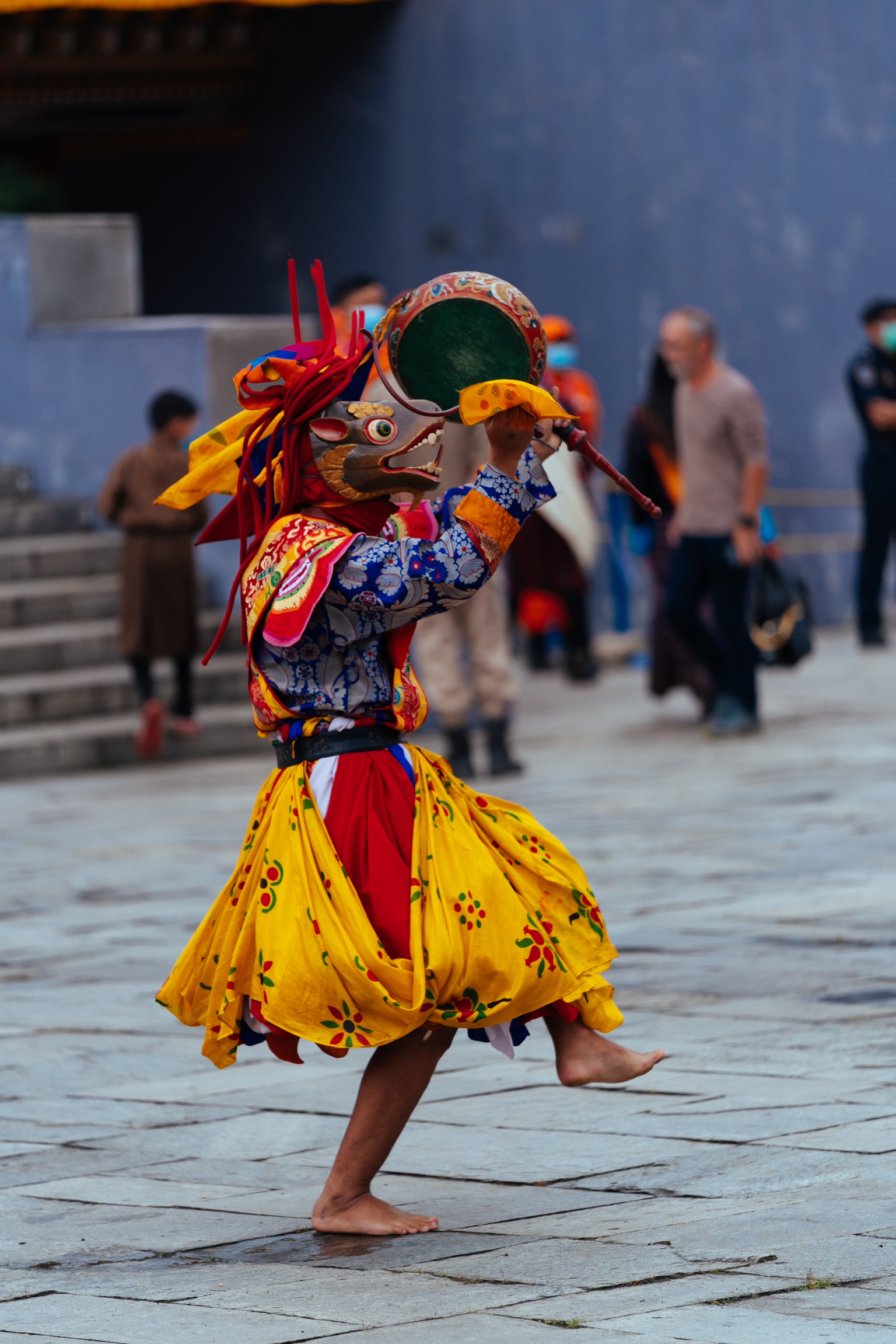 Masked dancer performing a traditional Bhutanese festival dance in Thimphu