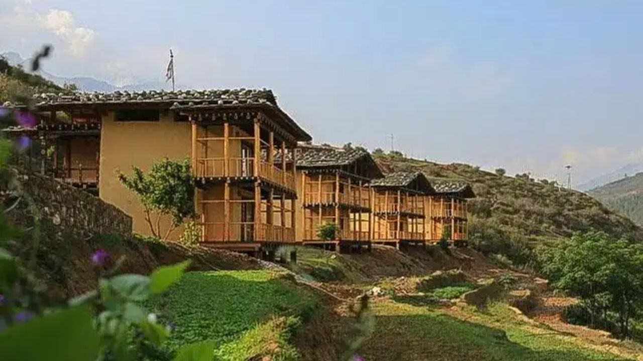 Wangdue Eco Lodge surrounded by forested hills, featuring eco-friendly design, traditional Bhutanese warmth, and peaceful natural surroundings.