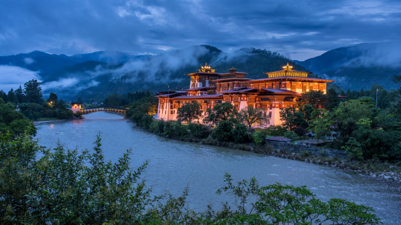 Evening view of Punakha Dzong glowing along the Mo Chhu River