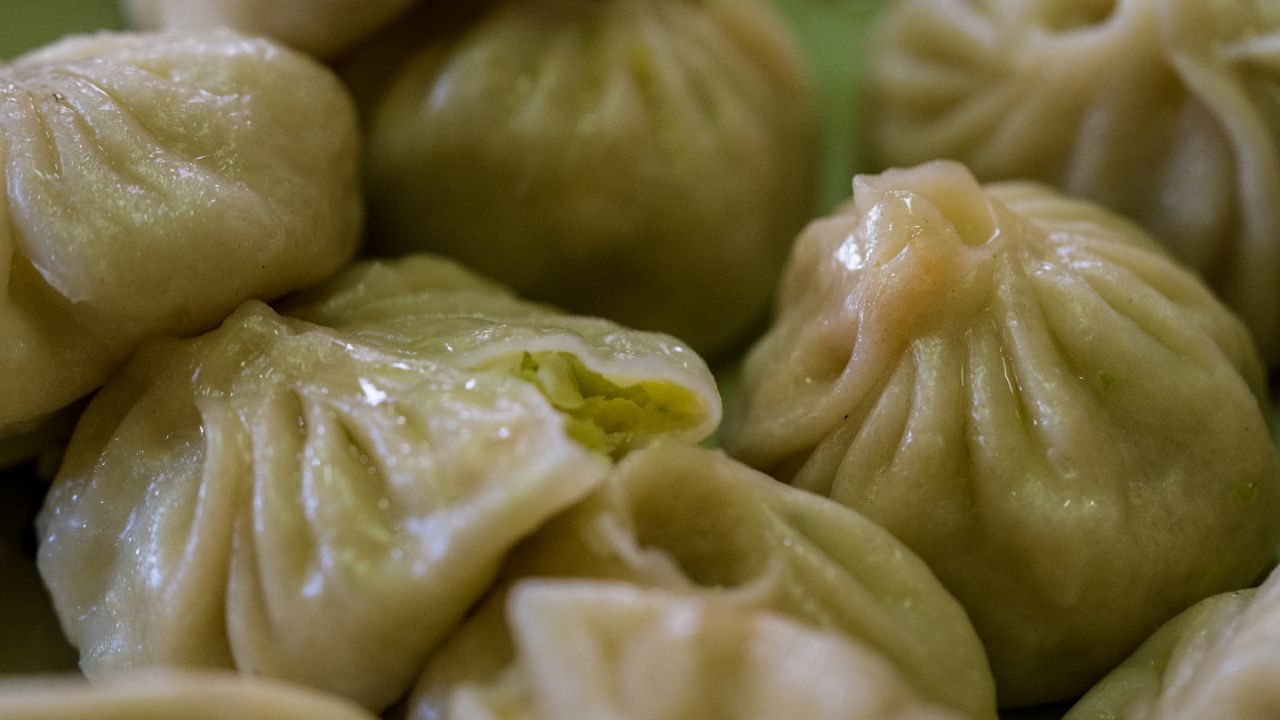 Bhutanese street food momos served fresh, traditional steamed dumplings popular in local markets.